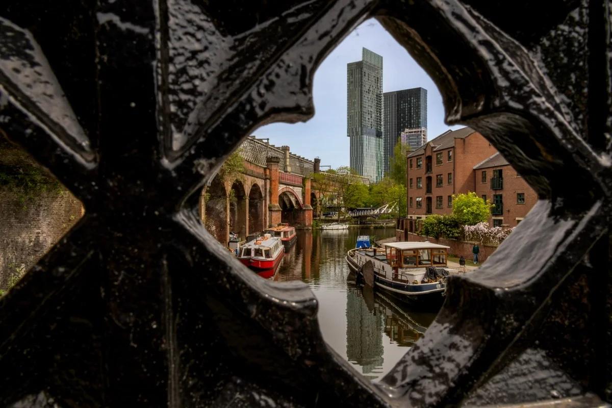 A view of Manchester from one of the ornate bridges in Castlefield