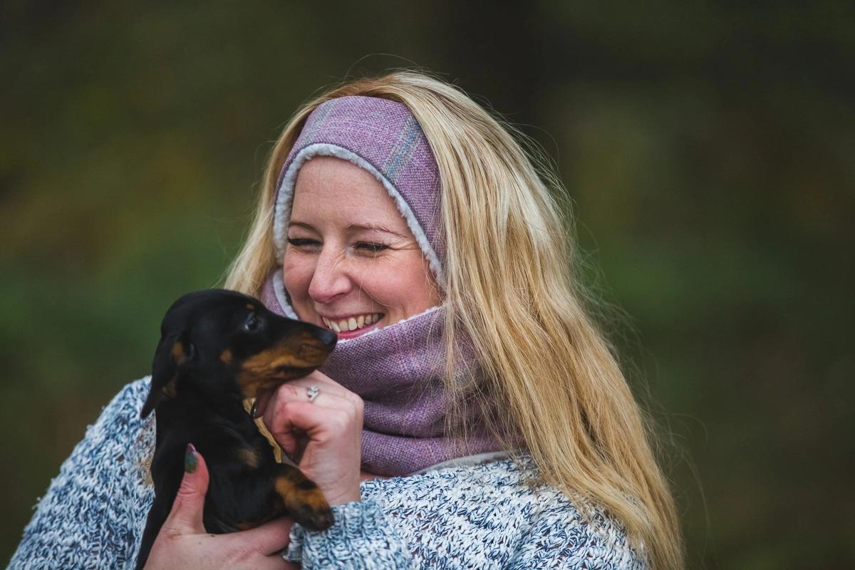 Danielle cuddling one of the dogs she looks after