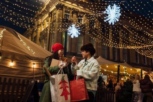 Images of people out Christmas shopping. Last-minute Christmas shopping could leave you in debt until the 2030s. Our Christmas Debt Calculator could help you keep on top of your festive spending