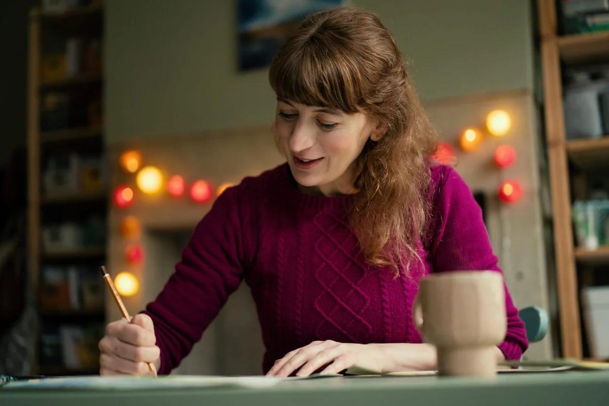 Julia drawing in her studio